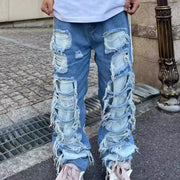 Ripped ripped patch jeans
