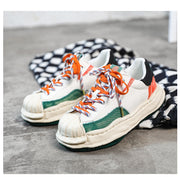 Dissolved shell toe color block shoes