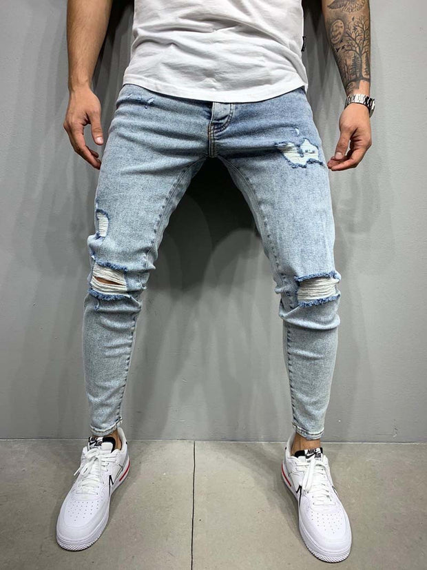 Autumn and winter new men's fashion light blue ripped slim jeans